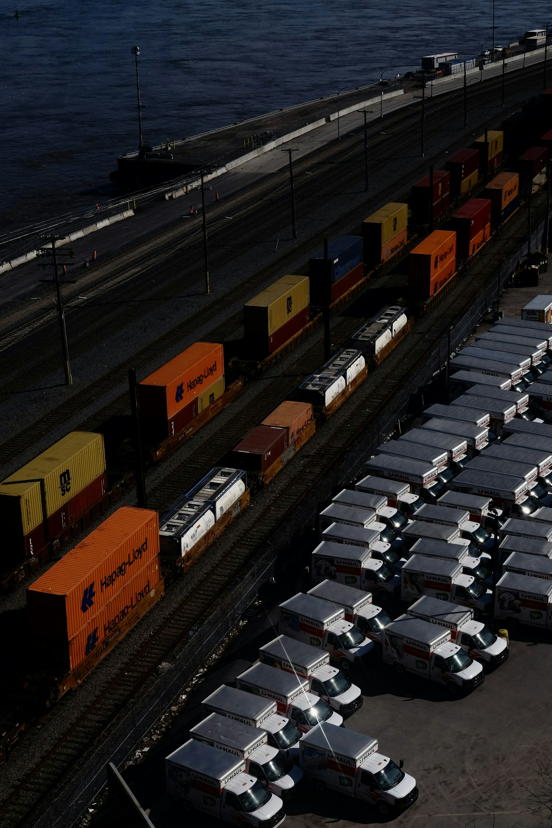 Freight containers moving through a port terminal